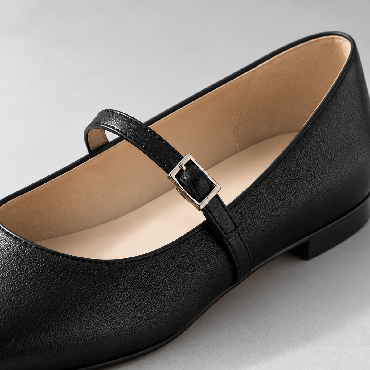 Mira Square-Toe Flat in Black — detail view